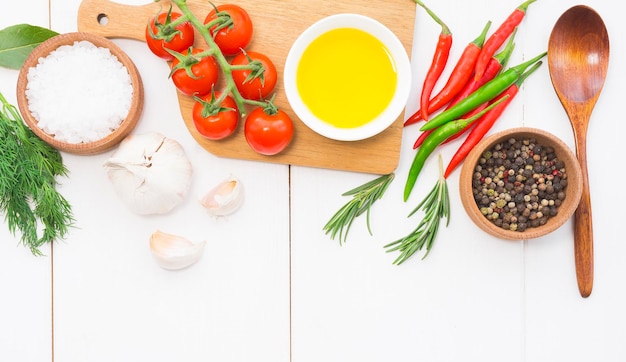 Assorted fresh ingredients and spices on wooden table
